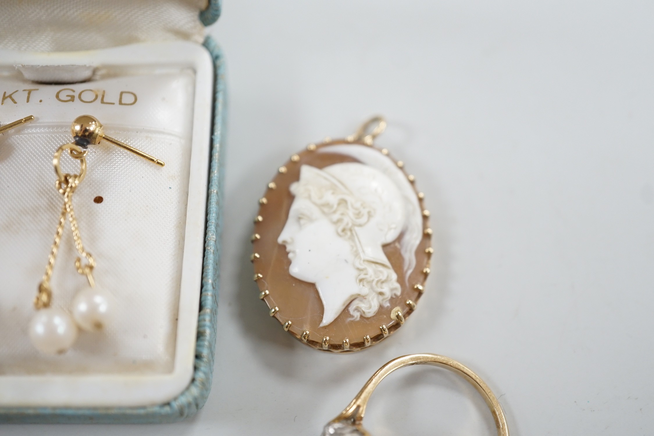 Mixed jewellery including two 9ct and gem set cluster rings and a 15ct, ruby and seed pearl set circular brooch, a yellow metal mounted oval cameo shell brooch, a pair of 9ct gold and gem set cluster ear studs, a 9ct whi